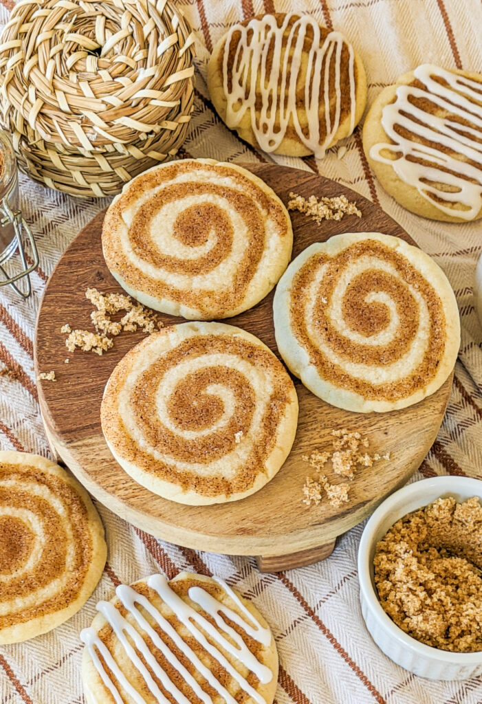 Cinnamon roll cookies served on tablecloth.